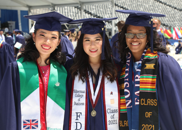 Three graduates of the Class of '21 look happy to be part of FDU's Gold Alumni Chapter